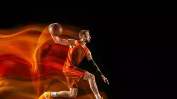 jugador de baloncesto con pelota de basket