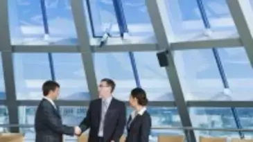 Businessmen shaking hands in the conference room