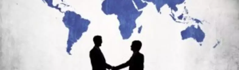 Businessmen Shaking Hands And Blue Cartography